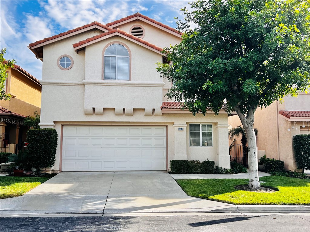 743 Orchard Loop Azusa, CA 91702 - Photo 3 of 38 a front view of a house with yard and garage