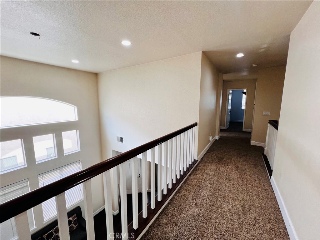 743 Orchard Loop Azusa, CA 91702 - Photo 33 of 38 a view of a hallway with a window