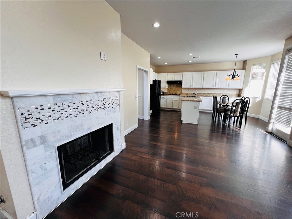 743 Orchard Loop Azusa, CA 91702 - Photo 8 of 38 a view of dining room with furniture and wooden floor