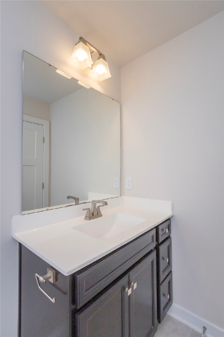 233 Scenic Road Anderson, SC 29621 - Photo 46 of 50 A well-appointed vanity with a large mirror defines this modern bathroom.