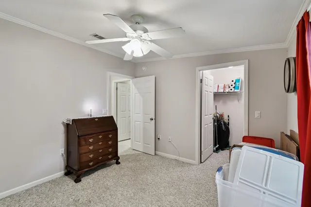 a view of a livingroom with furniture and a window