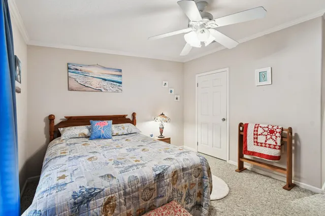 a room with stainless steel appliances a table and chairs