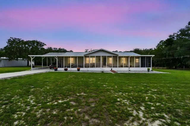 a kitchen with stainless steel appliances a sink stove and cabinets
