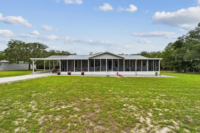 a kitchen with stainless steel appliances granite countertop sink stove and cabinets