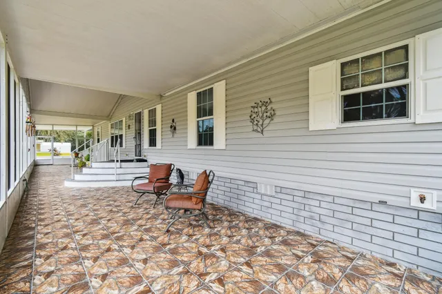 a kitchen with stainless steel appliances granite countertop a refrigerator stove top oven and sink