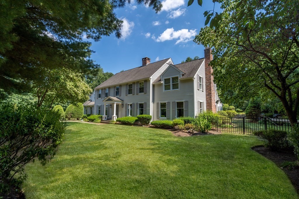 22 Hillcrest Road Weston, MA 02493 - Photo 1 of 31 a front view of a house with a garden