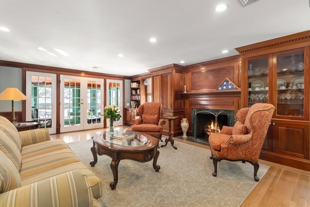 22 Hillcrest Road Weston, MA 02493 - Photo 14 of 31 a living room with furniture and a fireplace