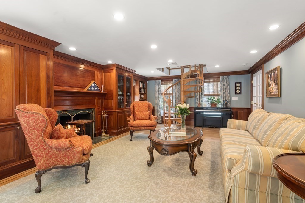 22 Hillcrest Road Weston, MA 02493 - Photo 15 of 31 a living room with fireplace furniture and a fireplace