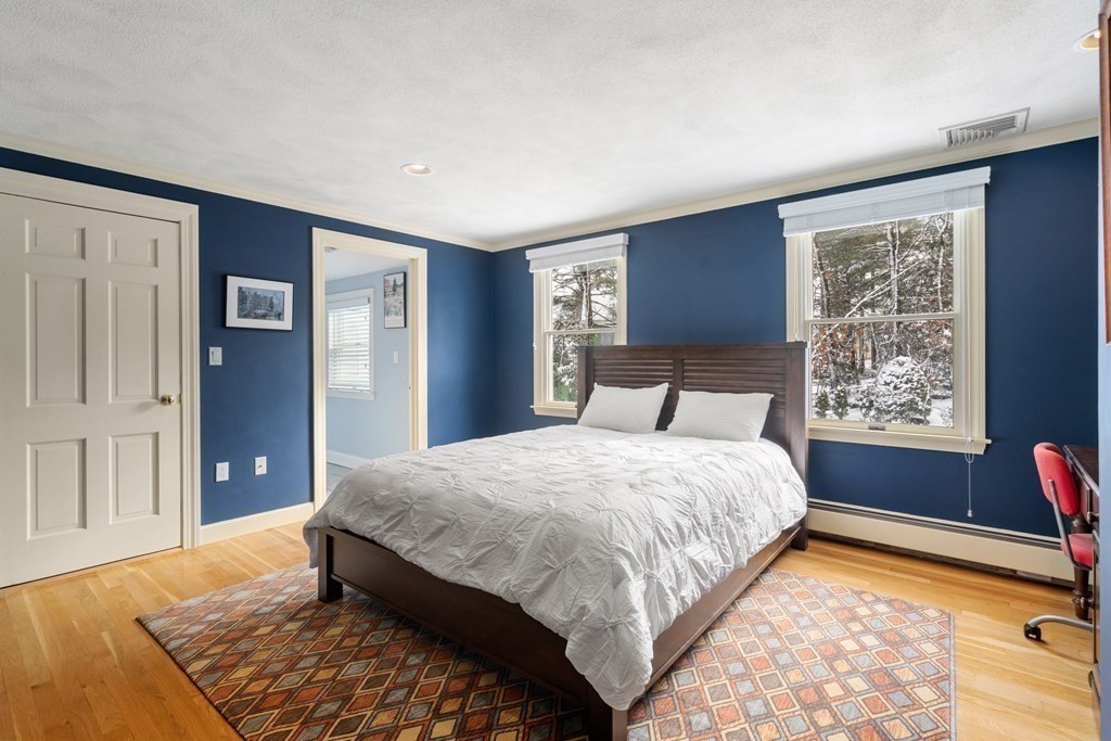 22 Hillcrest Road Weston, MA 02493 - Photo 21 of 31 a bedroom with a bed dresser and a window