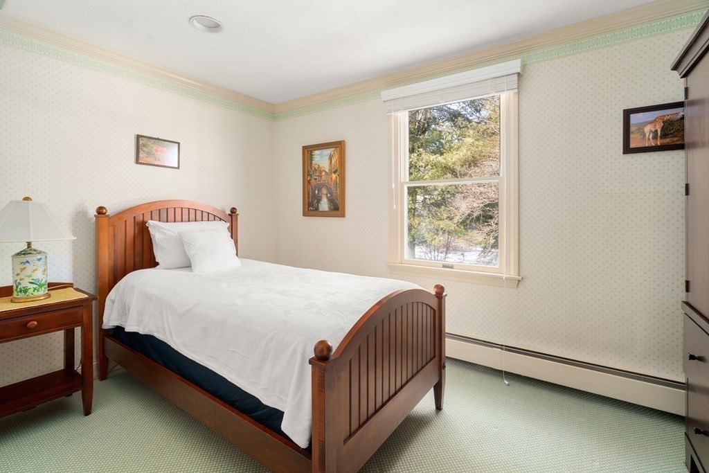 22 Hillcrest Road Weston, MA 02493 - Photo 23 of 31 a bedroom with a bed table and window
