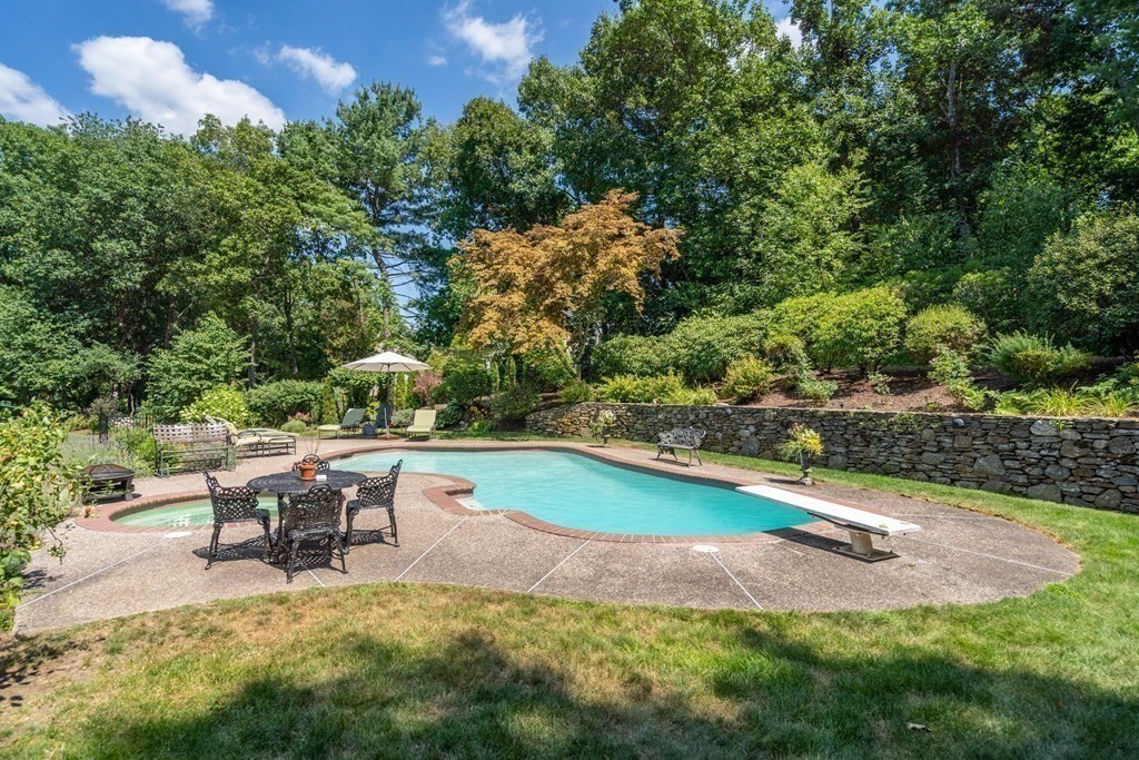 22 Hillcrest Road Weston, MA 02493 - Photo 3 of 31 a swimming pool with outdoor seating and yard