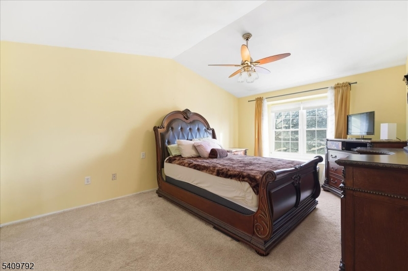 402 Porter Way West Bridgewater, NJ 08807 - Photo 12 of 29 a bed sitting in a room next to a window