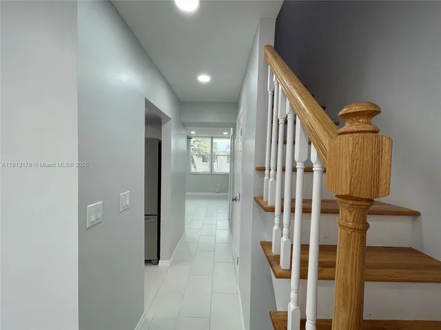 a view of a white building with many windows