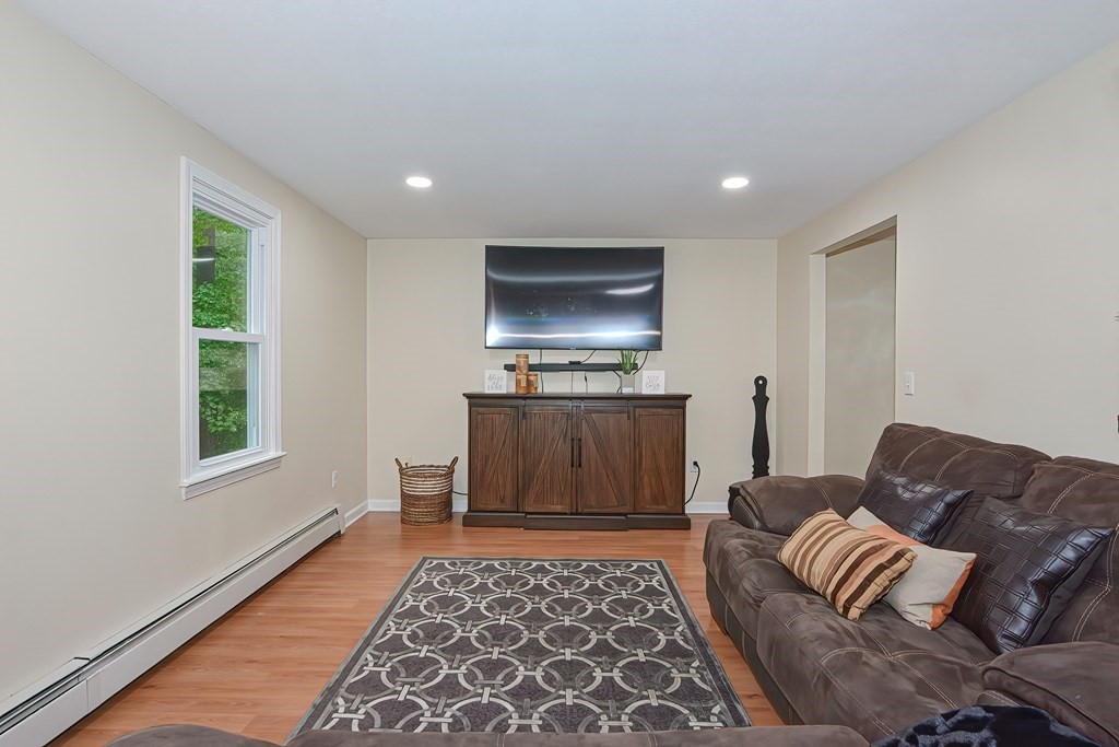 7 Proctor Road Pepperell, MA 01463 - Photo 12 of 40 a living room with furniture and a rug