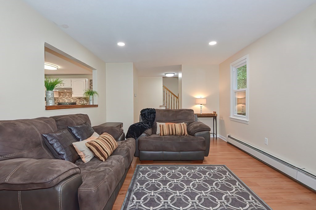 7 Proctor Road Pepperell, MA 01463 - Photo 13 of 40 a living room with furniture and a rug
