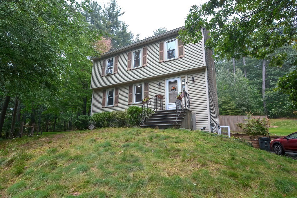 7 Proctor Road Pepperell, MA 01463 - Photo 2 of 40 a front view of a house with garden