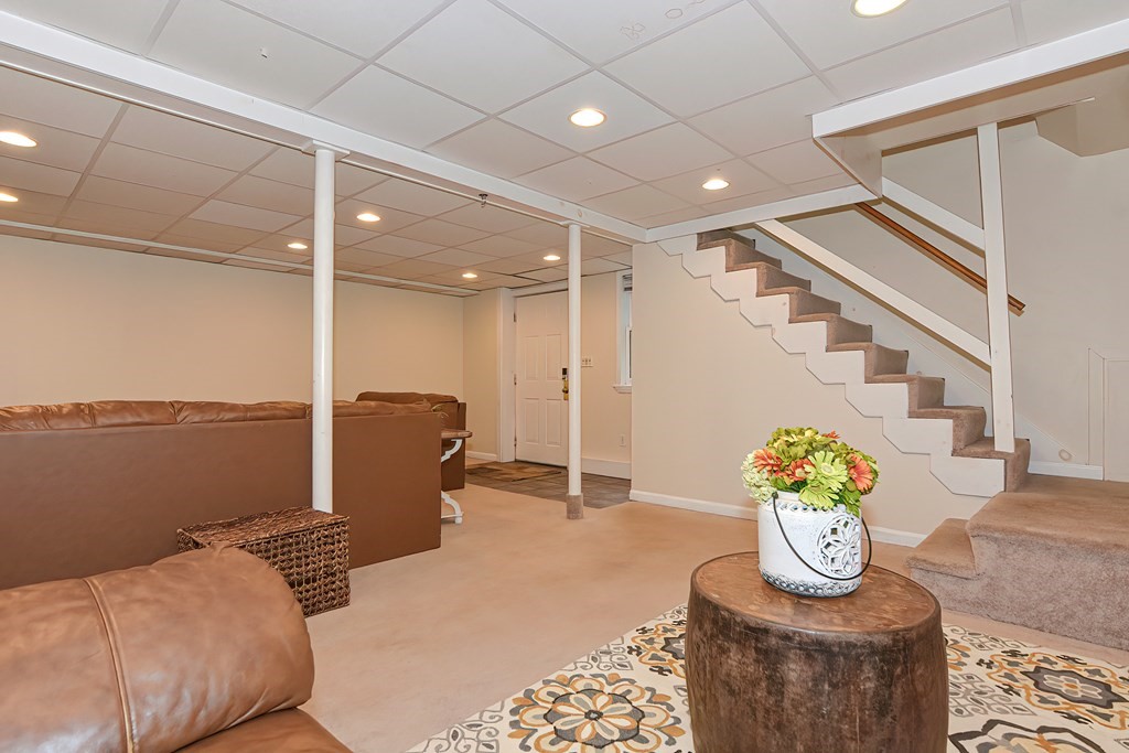 7 Proctor Road Pepperell, MA 01463 - Photo 35 of 40 a bedroom with furniture and a chandelier