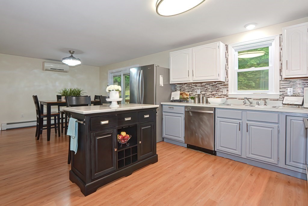 7 Proctor Road Pepperell, MA 01463 - Photo 7 of 40 a kitchen with a sink cabinets and window