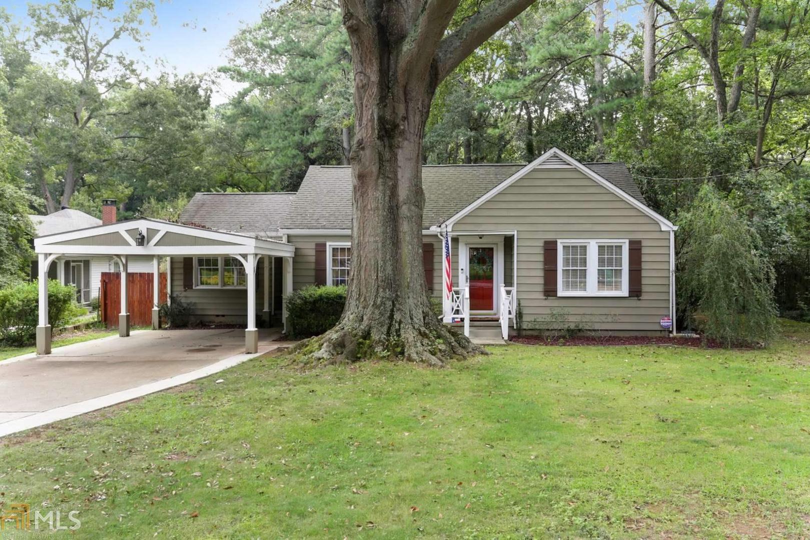 657 Medlock Road, Unit 1 Decatur, GA 30033 - Photo 1 of 1 a front view of a house with a garden