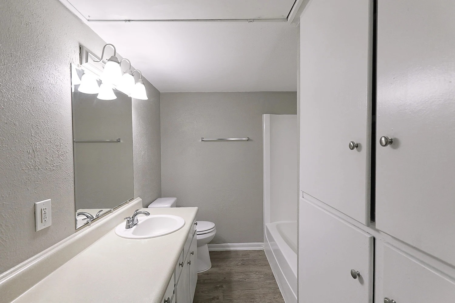 8100 North Mopac Expressway, Unit 2108 Austin, TX 78759 - Photo 16 of 23 Full bath featuring vanity, a textured wall, light wood-type flooring, and shower / washtub combination