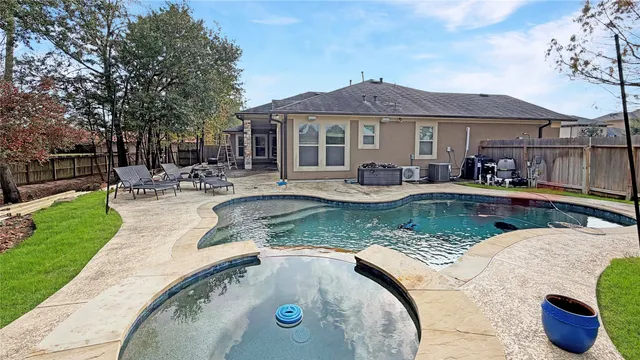 a view of pool with outdoor seating