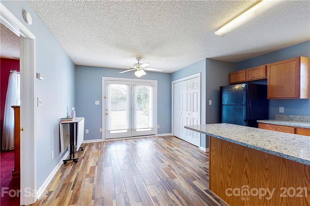 4262 Barley Street Southwest Concord, NC 28027 - Photo 2 of 27 wooden floor in an empty room with a window