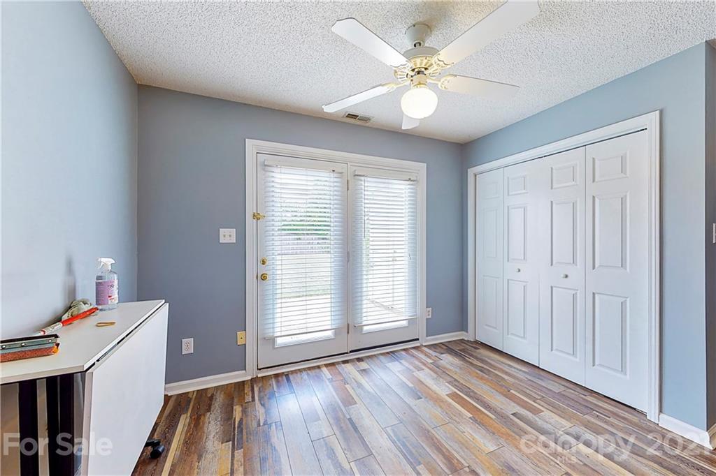 4262 Barley Street Southwest Concord, NC 28027 - Photo 11 of 27 wooden floor in an empty room with a window