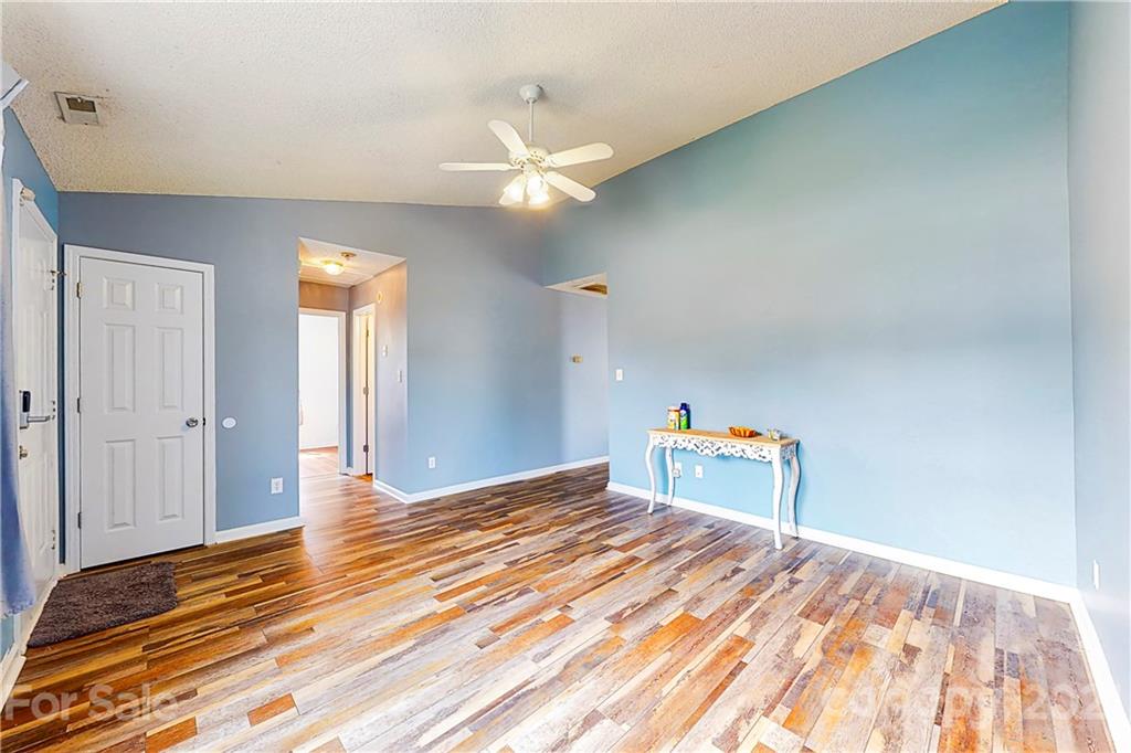 4262 Barley Street Southwest Concord, NC 28027 - Photo 14 of 27 a view of empty room with wooden floor and fan