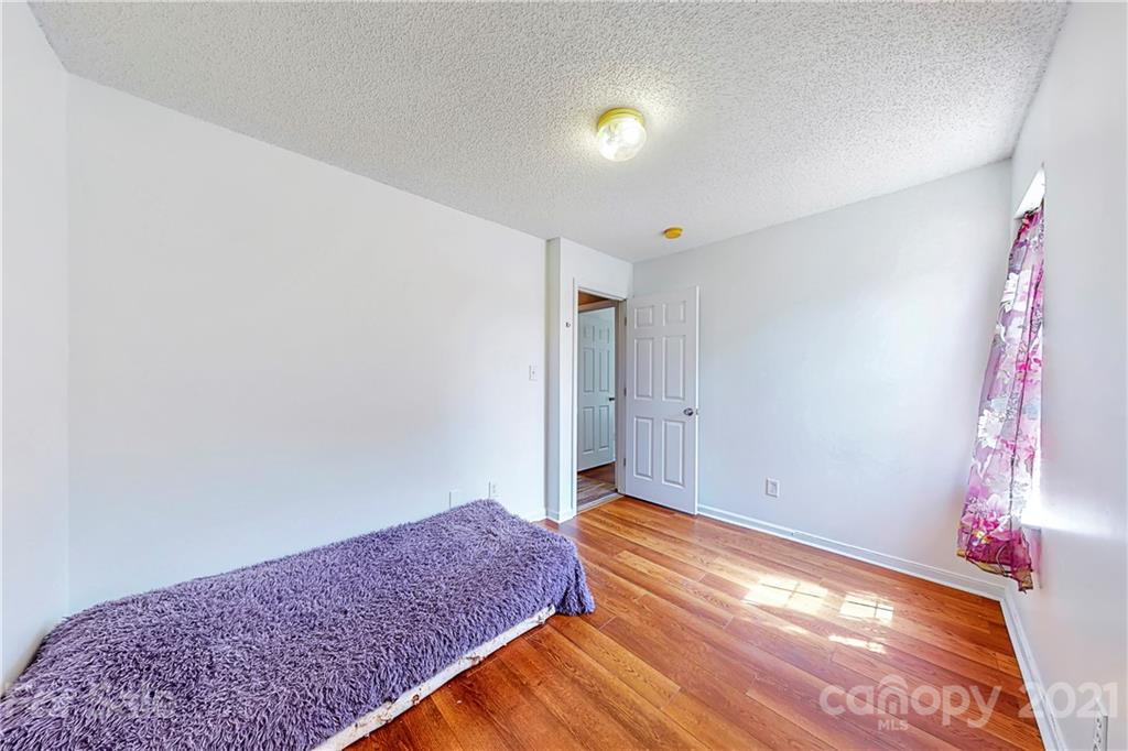 4262 Barley Street Southwest Concord, NC 28027 - Photo 21 of 27 a bedroom with a bed and a dresser