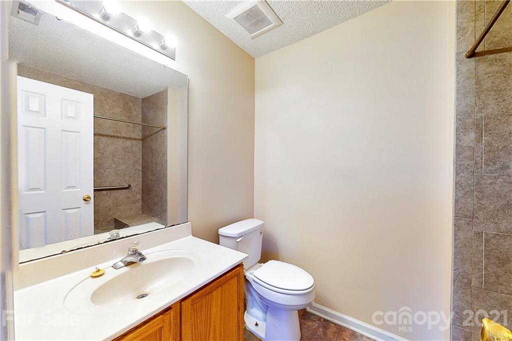 4262 Barley Street Southwest Concord, NC 28027 - Photo 8 of 27 a bathroom with a sink toilet and shower