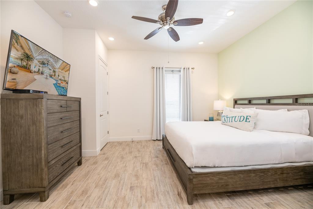 2956 Salted Rim Road Kissimmee, FL 34747 - Photo 11 of 12 a bedroom with a bed and a dresser