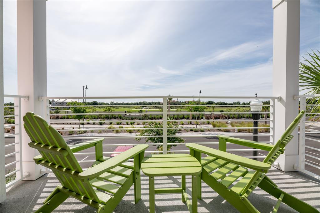 2956 Salted Rim Road Kissimmee, FL 34747 - Photo 2 of 12 a view of a chairs and table in the balcony