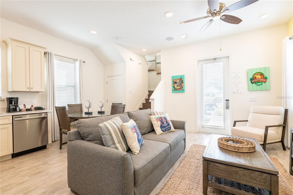 2956 Salted Rim Road Kissimmee, FL 34747 - Photo 3 of 12 a living room with furniture kitchen view and a window