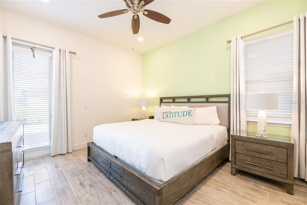 2956 Salted Rim Road Kissimmee, FL 34747 - Photo 7 of 12 a bedroom with a large bed and a window