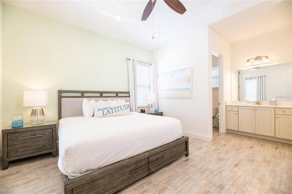 2956 Salted Rim Road Kissimmee, FL 34747 - Photo 10 of 12 a bedroom with a bed and a cabinets