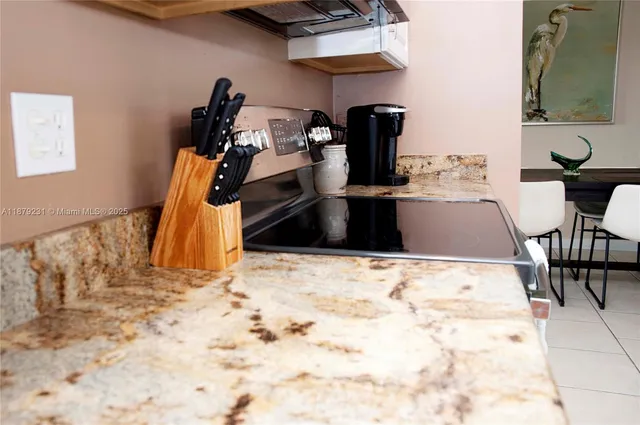 a view of a dining room with furniture and a window