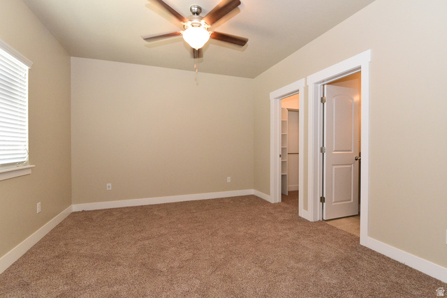 241 West Ridge Road Saratoga Springs, UT 84045 - Photo 11 of 21 Carpeted room featuring a ceiling fan with integrated lighting, white trim and baseboards, and a window with blinds