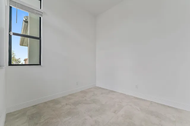 an empty room that has a window