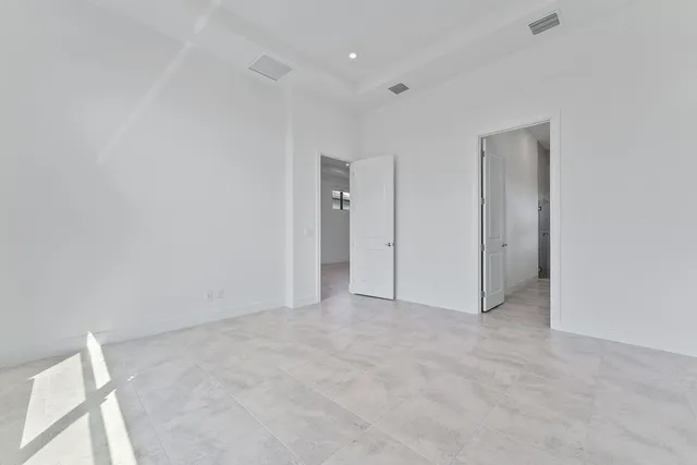 a bathroom with double sink and a mirror