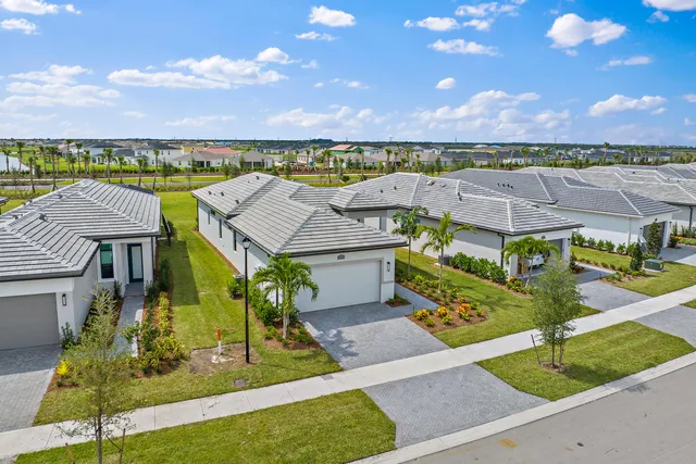 an aerial view of a house with a garden and plants