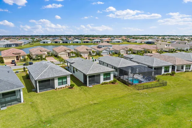 a aerial view of a house with a big yard