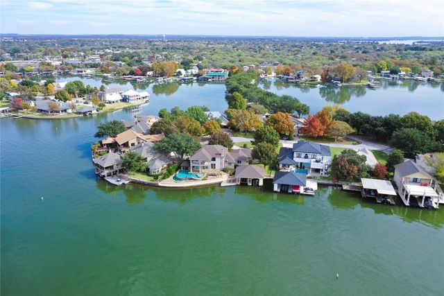 an aerial view of a house with a lake view