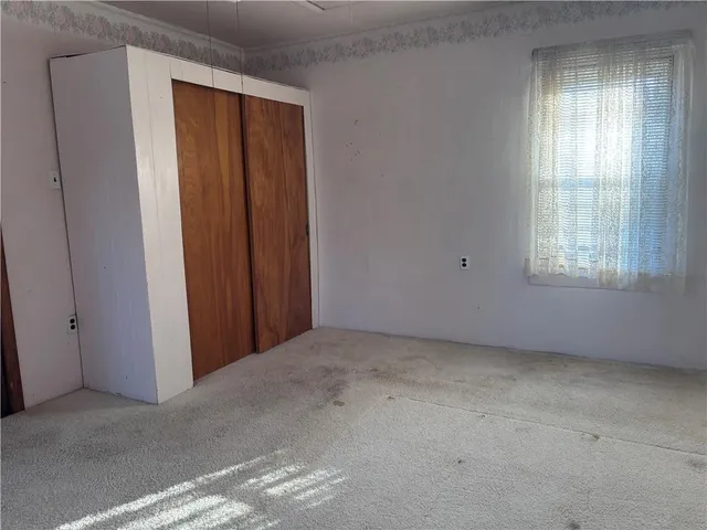 a room with chair and windows