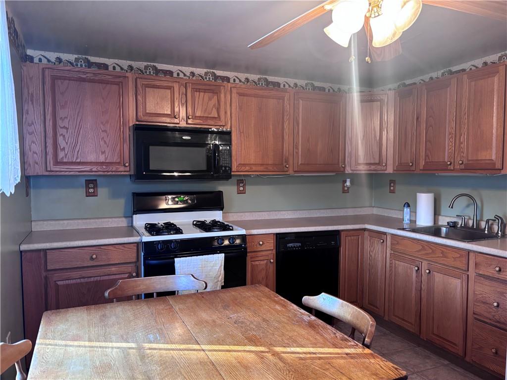 1776 Main Street Allenport, PA 15412 - Photo 2 of 16 a kitchen with a sink cabinets and stainless steel appliances