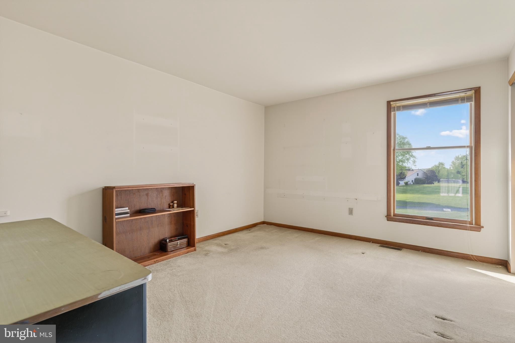 9 Drake Road Chesapeake City, MD 21915 - Photo 17 of 39 a room with a window and a table