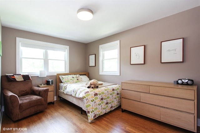 1230 Kenton Road Deerfield, IL 60015 - Photo 14 of 22 a bedroom with a bed and a couch