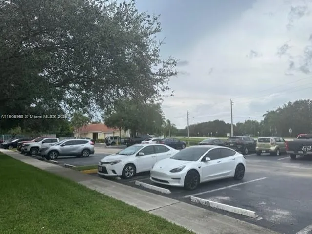a couple of cars parked in a parking lot