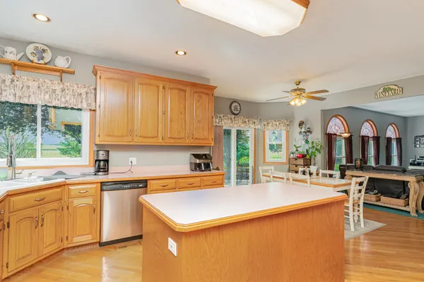 a kitchen with a stove a sink and a refrigerator