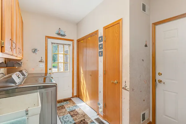 a view of a bathroom with sink and mirror