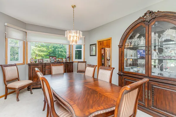 a view of a dining room with furniture window and outside view